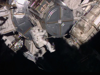 Illustration for article titled Fragile Humans Spacewalk To Upgrade Space Station Communications